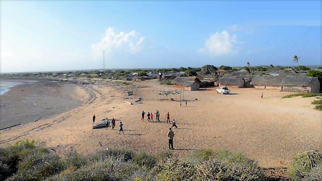 Sandy beach and calm sea at Kamboni, Lower Juba region, Somalia.